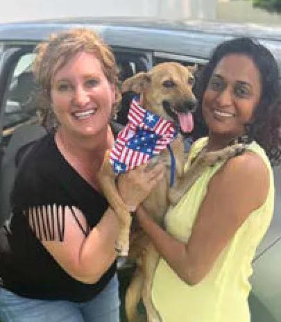 Chloe, a SAFI rescue dog from India, with their family in Nashville, TN