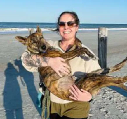 Potti, a SAFI rescue dog from India, with their family in Florida