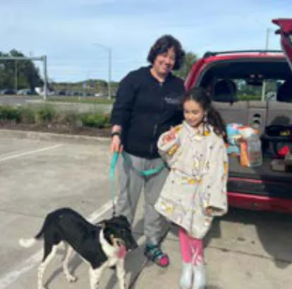 Ravi, a SAFI rescue dog from India, with their family in Florida