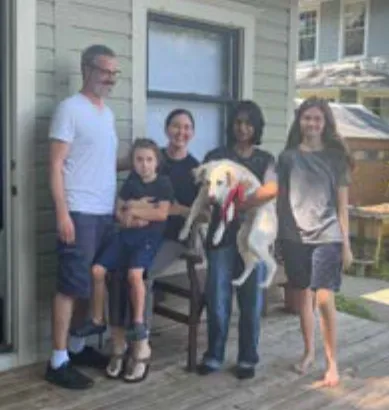 Scout, a SAFI rescue dog from India, with their family in Florida