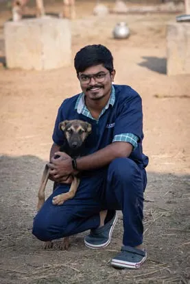 A SAFI team member with a rescued dog